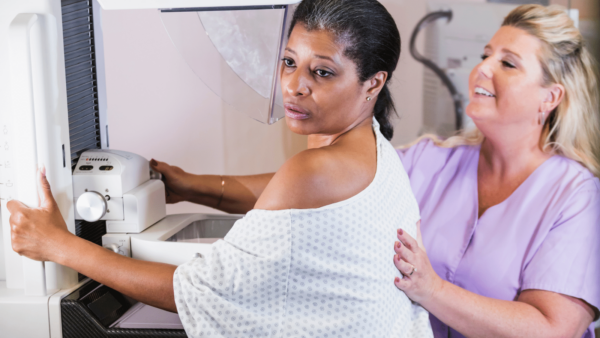 Operational efficiencies in mammography: Middle-aged black woman receiving mammogram