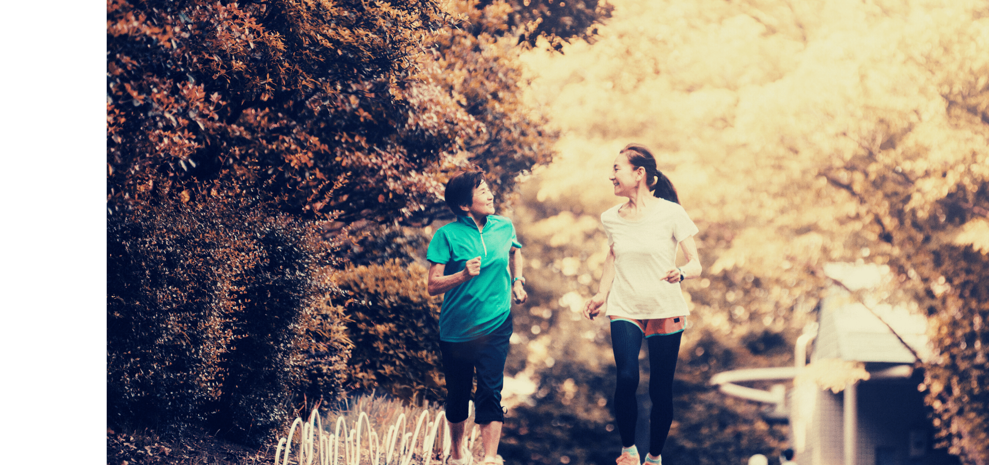 Two asian women running outdoors