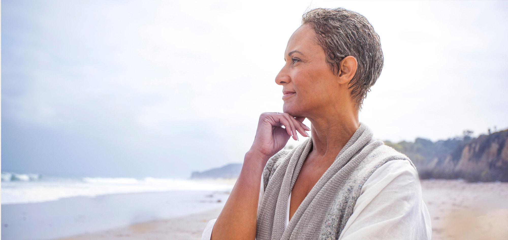 Middle-aged woman looking at ocean